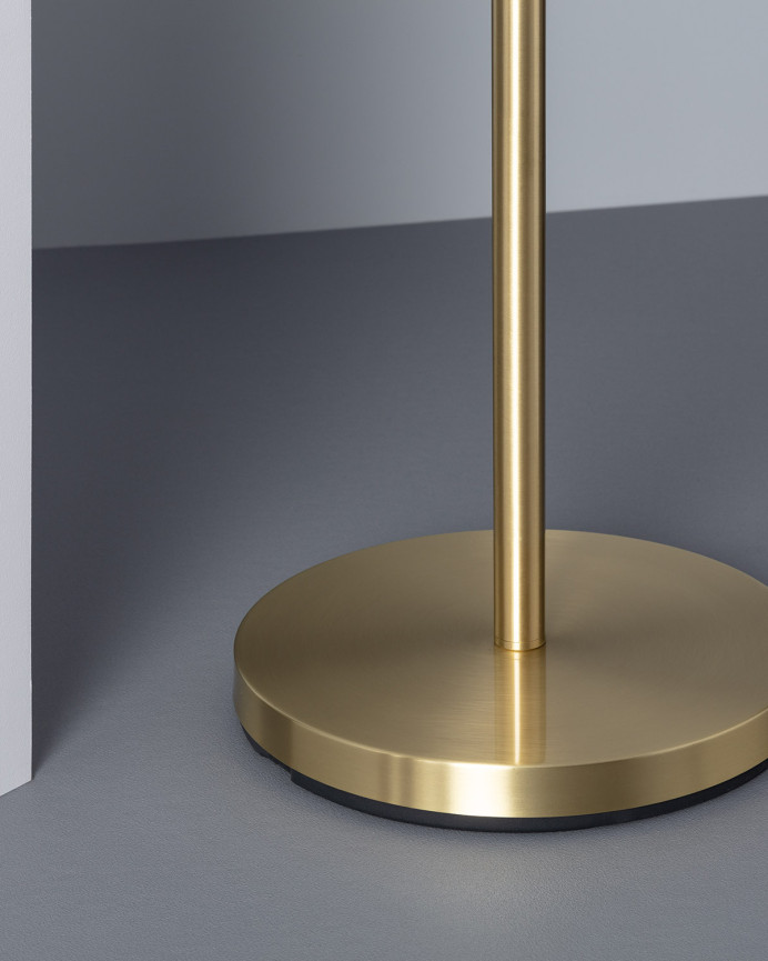 Lampadaire composé d'une base en aluminium doré et de trois sphères en verre transparent